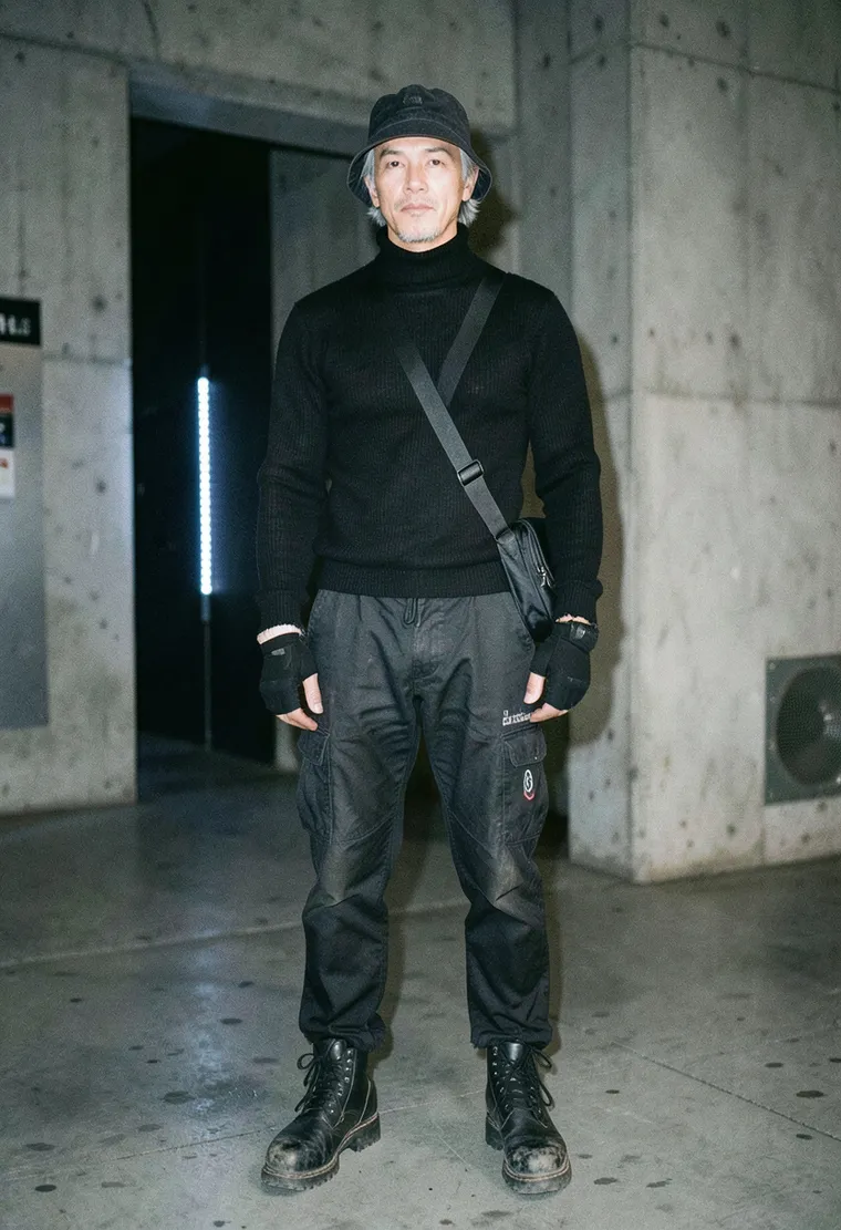 38-year-old non-binary Vietnamese techno head with quiet, weathered dedication honed from 12 years of attending Berlin underground warehouse sets